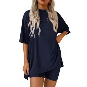 Navy blue oversized T-shirt and matching biker shorts lounge set worn by a model