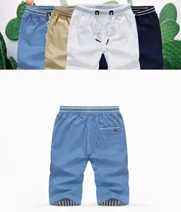 Collection of men's lightweight summer shorts in various colors with stripe waistband