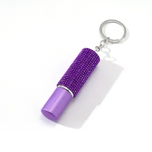 Mini flacon vaporisateur de parfum violet 5ml avec strass et anneau porte-clés.