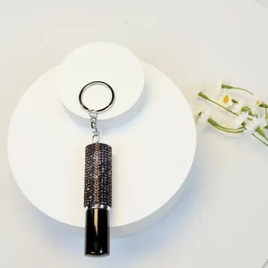 Detailed close-up of a 5ml rhinestone-encrusted portable perfume bottle keychain spray