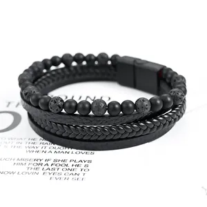 Macro view of multi-layer men's leather bracelet with lava stone beads and magnetic clasp