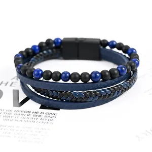 Close-up of blue natural stone and black beads on multi-layer braided leather bracelet.