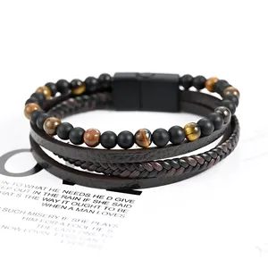 Detailed view of men's multi-layer braided leather bracelet with tiger eye beads