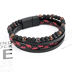 Close-up of men's multi-layer leather bracelet with matte beads and magnetic clasp