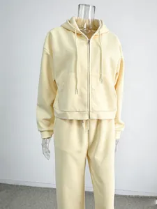 Women's casual two-piece zip-up hooded sweatshirt and matching pants set in light yellow