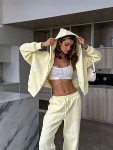 Oversized pale yellow zip-up hoodie and matching sweatpants lounge set for women