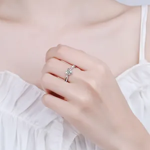 Elegant S925 sterling silver heart-shaped moissanite ring shown on a model's hand