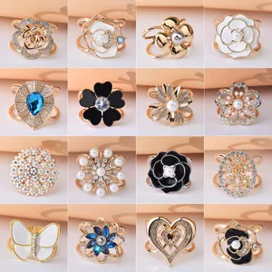 Elegant assortment of floral and heart-shaped scarf rings with crystals and pearls