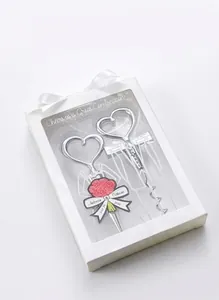 Elegant heart-shaped wine opener gift set in white packaging with silk ribbon detail