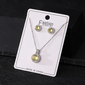 Detailed shot of copper zircon round earring and necklace jewelry set in yellow