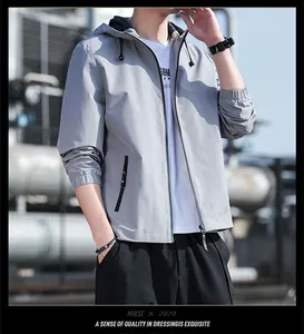 Casual men's slim-fit hooded windbreaker jacket in light grey for the spring season