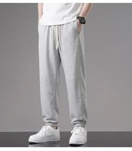 Full side view of stylish men's grey lightweight cotton joggers with comfy elastic cuffs