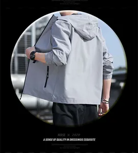 Detailed back view of a grey men's lightweight hooded jacket for casual spring fashion