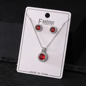 Elegant copper jewelry set featuring round red zircon necklace and stud earrings