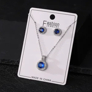 Elegant silver-toned necklace and stud earrings set with round blue zircon accents