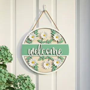 Fresh round wooden welcome sign with artificial daisies and green leaves for home decor