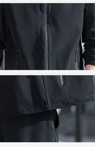 Primer plano de la cremallera y el dobladillo en una chaqueta ligera negra de hombre.