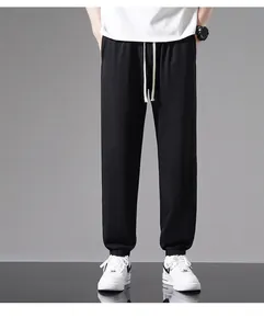 Men's lightweight black jogger pants with elastic cuffs for a casual summer style.