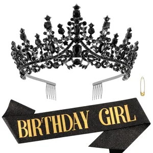 Detailed view of the black rhinestone tiara and gold Birthday Girl sash set
