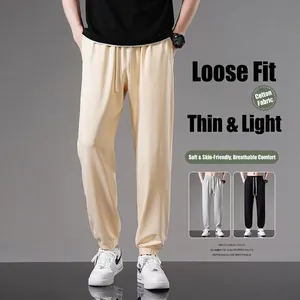 Stylish men's loose cotton sweatpants, thin breathable summer joggers for casual wear.
