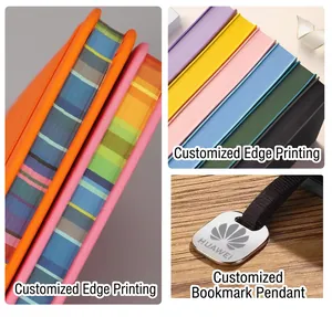 Detail of A5 notebook featuring colorful striped spray-painted edges and metal pendant