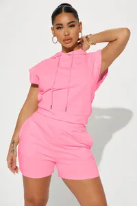 Detail view of bright pink sleeveless hooded top and shorts casual set for women