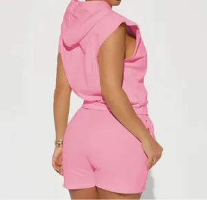Back view of a women's two-piece pink casual set with a sleeveless hoodie and shorts.