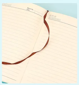 Close-up of internal lined pages of a minimalist A5 notebook with ribbon bookmark