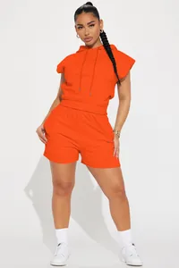 Vibrant orange two-piece casual set featuring a short-sleeve hoodie and shorts.
