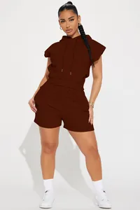 Full body view of brown sleeveless hoodie and shorts tracksuit set shown on a model