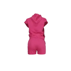 Back view of pink sleeveless hooded top and shorts set for a casual street look