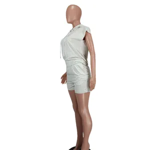 Side profile view of a grey sleeveless hooded top and matching shorts set on mannequin