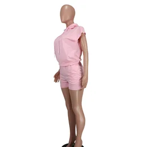 Side view of a pink sleeveless hoodie and shorts two-piece casual set for women