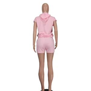 Back view of pink women's sleeveless casual hoodie and matching shorts set