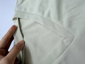 Close-up detail of the reinforced collar and stitching on women's casual sweatshirt