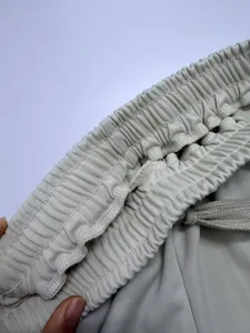 Macro shot showing the detailed elastic waistband of women's casual drawstring pants
