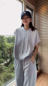 Chic light blue two-piece leisure tracksuit set with hooded top and loose fit pants
