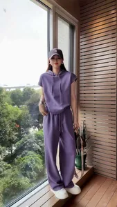 Detail view of a purple two-piece leisure tracksuit for women in a comfortable loose fit