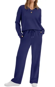 Elegant navy blue long-sleeved loungewear set with V-neck top and drawstring pants.