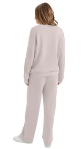 Back view of women's long sleeve solid color casual sweatshirt and pants lounge set.