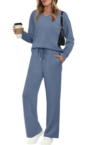 Full body view of women's stylish blue two-piece lounge set with drawstring pants