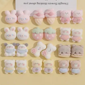 Collection of cute fluffy DIY charms including bears, bunnies, strawberries, and ice cream.