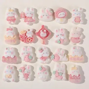 Collection of cute pink and white resin rabbit charms for DIY hair accessories and crafts.