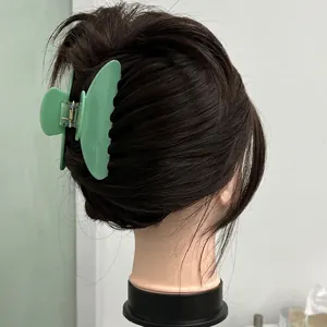 Large mint green shell shaped acrylic hair claw clip for elegant women bun hairstyles