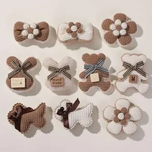 Assorted handmade plush animal and floral patches for DIY hair accessories and cases