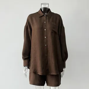 Brown linen-textured long-sleeve shirt and matching shorts set on mannequin