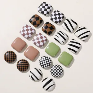 Mixed checkerboard and cow print geometric square buttons for DIY crafts