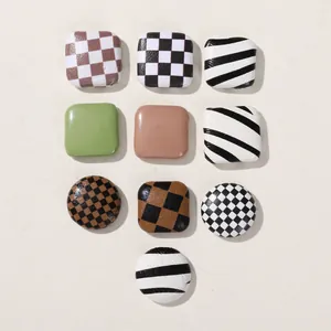 Checkerboard and cow print geometric square buttons for DIY hair accessory crafting