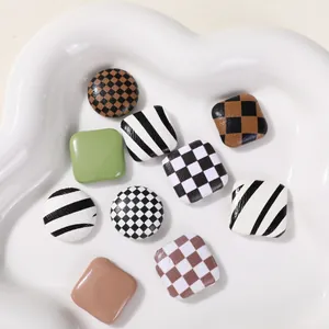 Set of checkerboard and striped geometric buttons for DIY hair accessories and phone cases