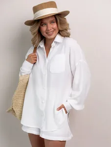 Women's white oversized button-down shirt and shorts set for a chic summer look
